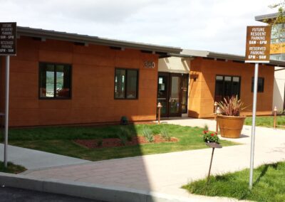 A brown building with a green roof.