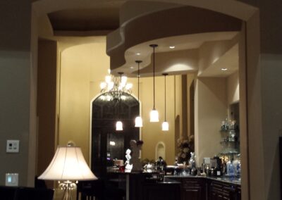 A living room with a dining table and chairs.