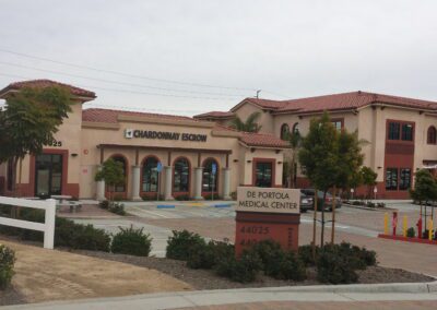 A building with a parking lot in front of it.