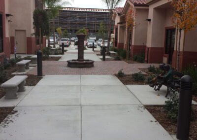 A sidewalk in front of a building.