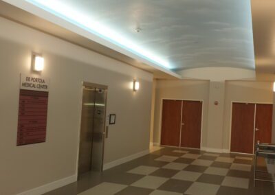 A hallway with a checkered floor and a ceiling.