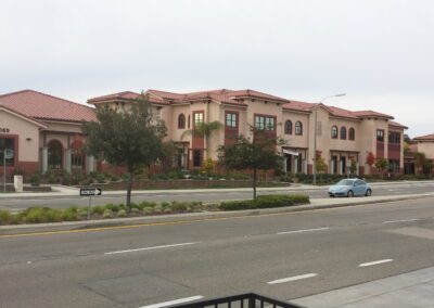 A red brick building on a street.