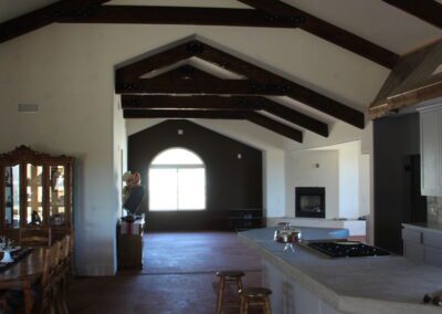 A kitchen with a dining table and chairs.