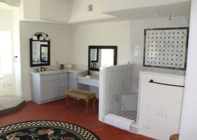 A bathroom with a tub and a shower.