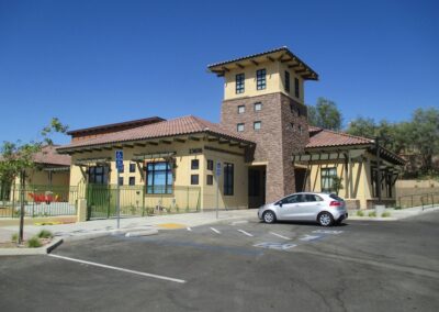 A building with a car parked in front of it.