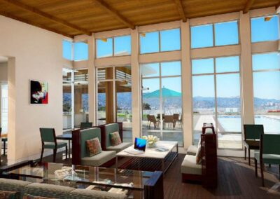 A living room with large windows overlooking a lake.